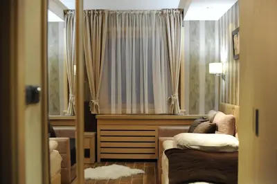 a living room with a couch and a window at Apartman Mitra Angella Konaci in Kopaonik