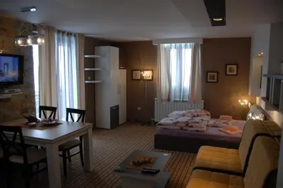 a living room with a couch and a table at Villa Milmari in Kopaonik