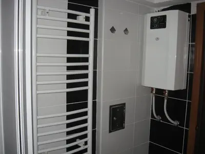 a shower in a bathroom with a white and black at Villa Sofija in Kopaonik