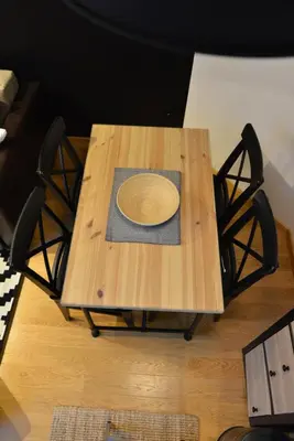 a wooden table with a plate on top of it at Višnja apartment in Kopaonik