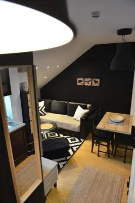 a living room with a couch and a table at Višnja apartment in Kopaonik