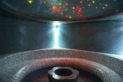 a room with a stone tub with a ceiling at Hotel Kraljevi Čardaci in Kopaonik