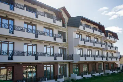 an exterior view of a building with balconies at Milmari Resort, Apartman Premier 27 in Kopaonik