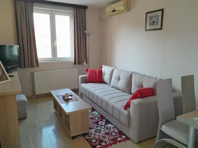 a living room with a couch and a coffee table at Vila Paradi in Vrnjačka Banja