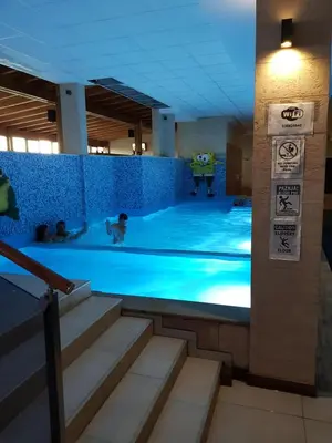 a large swimming pool with people in it at Milmari, Resort, Premier Apartman A52 & Parking garage FREE in Kopaonik