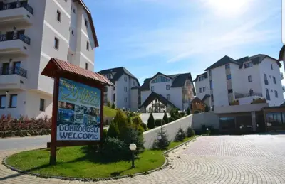 a sign in front of a group of buildings at Milmari, Resort, Premier Apartman A52 & Parking garage FREE in Kopaonik