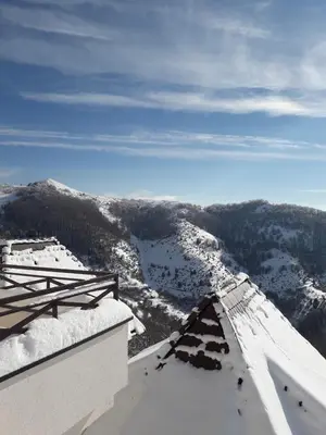 a view from the top of a snow covered mountain at Apartman D52 Dvori in Kopaonik