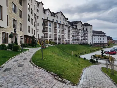 a street in front of a large building at Milmari L29 in Kopaonik
