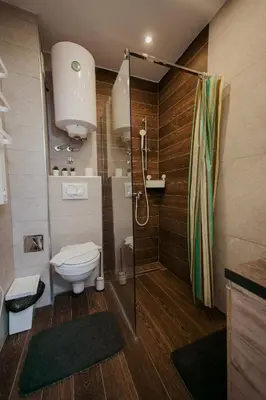 a bathroom with a shower and a toilet in it at Milmari L29 in Kopaonik