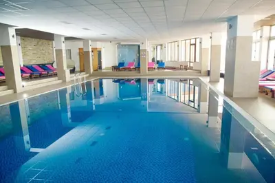a large swimming pool in a large building at Kophill L36 Milmari in Kopaonik