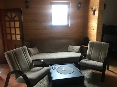 a living room with a couch and two chairs and a table at Villa Popara Kopaonik in Kopaonik