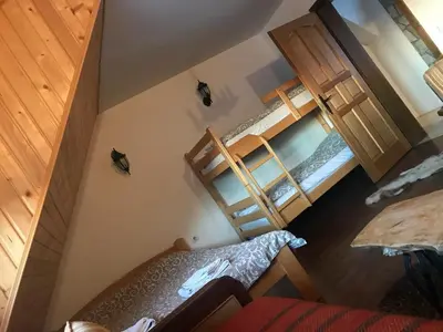 an overhead view of a bedroom with two bunk beds at Villa Popara Kopaonik in Kopaonik