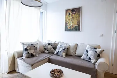 a living room with a couch and a table at PROMO Evergreen apartments in Kopaonik
