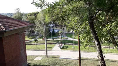 a view of a park with people walking on a sidewalk at Privatan smestaj knjazevac in Knjazevac.