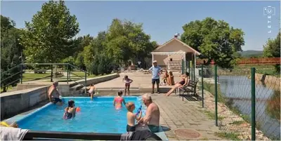 a group of people playing in a swimming pool at Privatan smestaj knjazevac in Knjazevac.