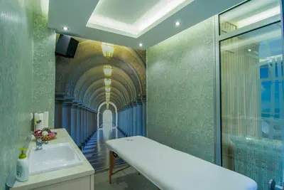 a bathroom with a sink and a hallway with a ceiling at Vila Ljubica in Vrnjačka Banja