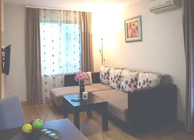 a living room with a couch and a table at Vila Ljubica in Vrnjačka Banja