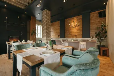 a dining room with a table and chairs at Hotel ABC in Leskovac
