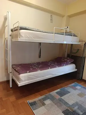 two bunk beds in a room with a rug at Ljubica in Brzeće