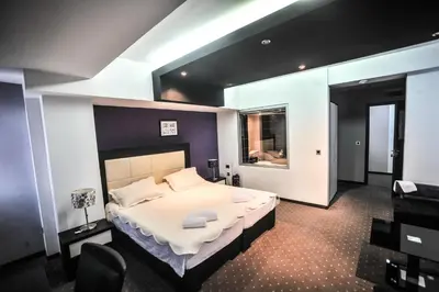 a bedroom with a large bed in a room at B&B Rose in Vranje