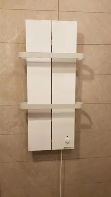 two white shelves on a wall at Milmari RELAX apartment in Kopaonik
