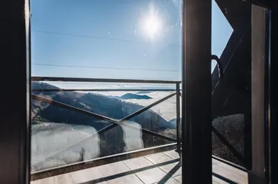 a view from a window of a mountain view at Jules Verne apartments in Kopaonik
