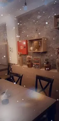 a room with a table and a stone wall at Milmari L44 in Kopaonik