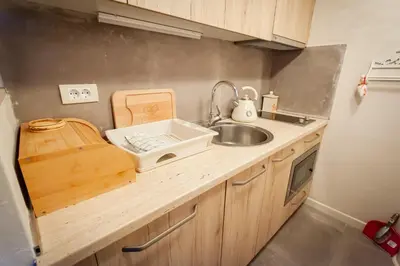 a kitchen counter with a sink and a sink at Top Lux Zupa in Kopaonik