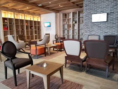 a room with chairs and tables in a store at Top Lux Zupa in Kopaonik