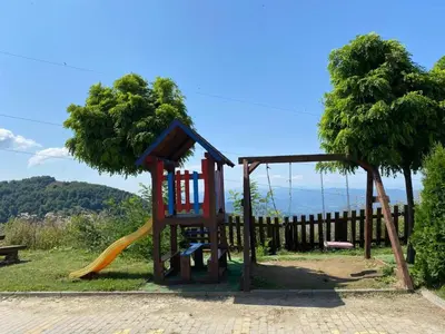 a playground with a slide and a slideintend at Privat Studio Milmari in Kopaonik