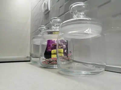 a group of glass jars sitting on top of a counter at Apartment Lavina Kopaonik in Kopaonik