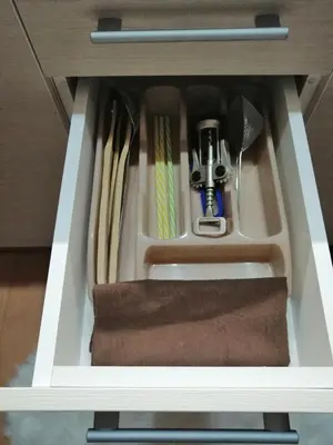 a drawer in a cabinet with kitchen utensils at Apartment Lavina Kopaonik in Kopaonik