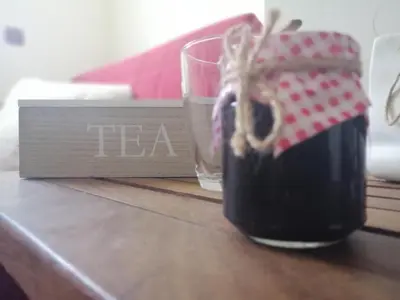 a glass of tea sitting on top of a table at Apartment Lavina Kopaonik in Kopaonik