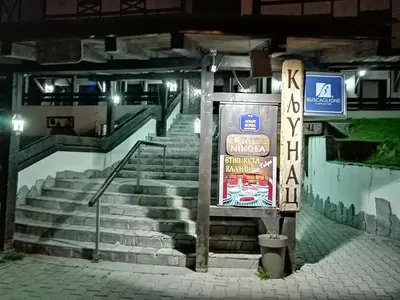 a set of stairs in a building with a sign at Apartment Lavina Kopaonik in Kopaonik