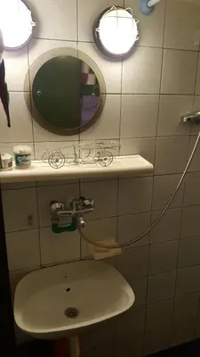 a bathroom with a sink and a mirror at GreenPointMountainHouse for 6 persons in Kopaonik