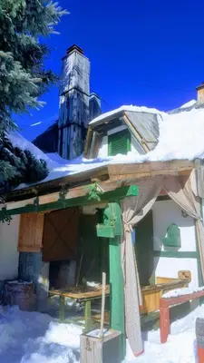 a house with snow on top of it at GreenPointMountainHouse for 6 persons in Kopaonik