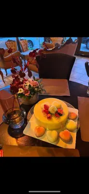 a table with a cake and a plate of cookies at Villa Grazia in Vladičin Han