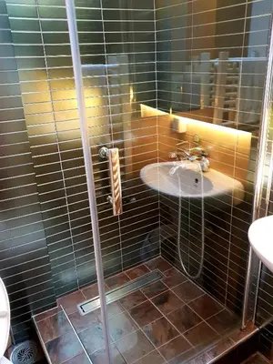a bathroom with a shower with a sink at Villa Grazia in Vladičin Han