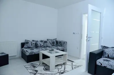 a living room with a couch and a table at BEST Apartments in Paraćin