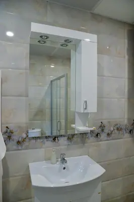 a bathroom with a sink and a mirror at BEST Apartments in Paraćin