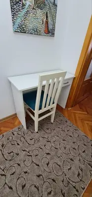 a white desk with a chair and a mirror at Apartman DUNJA sa terasom in Vranje