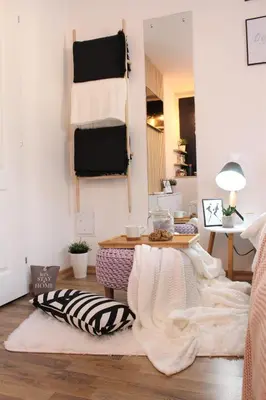 a living room with a table and a blanket on the floor at Apartment Take a breath in Vrnjačka Banja