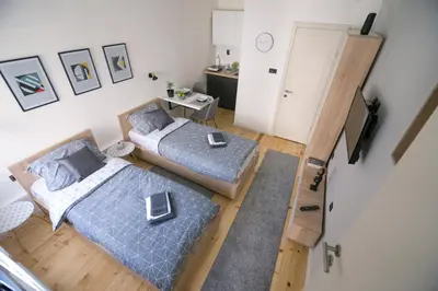 an overhead view of a bedroom with two beds at Sunrise Apartments in Niš