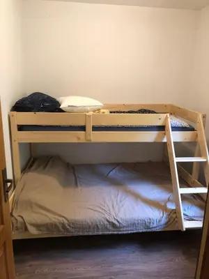 a bunk bed room with two bunk beds in a room at Vila Idila in Crni Vrh