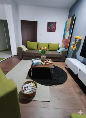 a living room with a couch and a coffee table at Fast Sleep & Go 1 in Paraćin