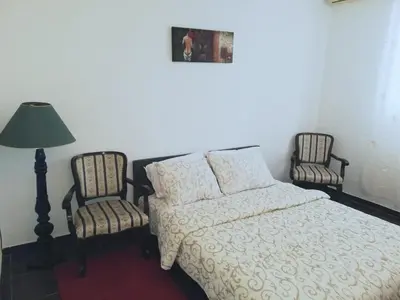 a bedroom with a bed and two chairs at Fast Sleep & Go 1 in Paraćin
