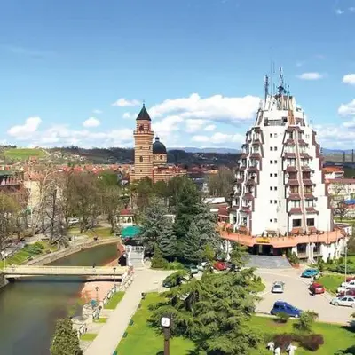a city with a large white building next to a river at Fast Sleep & Go 1 in Paraćin