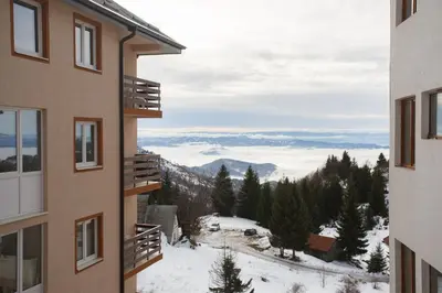 a view of the mountains from the balcony of a building at Vila Trag in Kopaonik