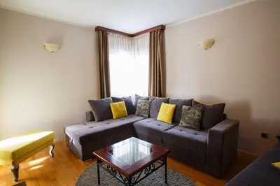 a living room with a couch and a coffee table at Vila Trag in Kopaonik