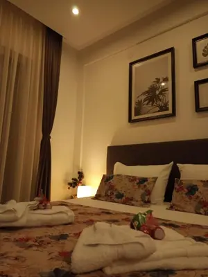 a bedroom with a bed with towels on it at Milmari L4 in Kopaonik